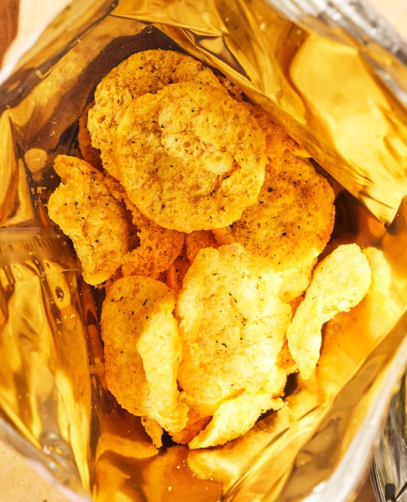 Crispy potato chips inside a golden bag