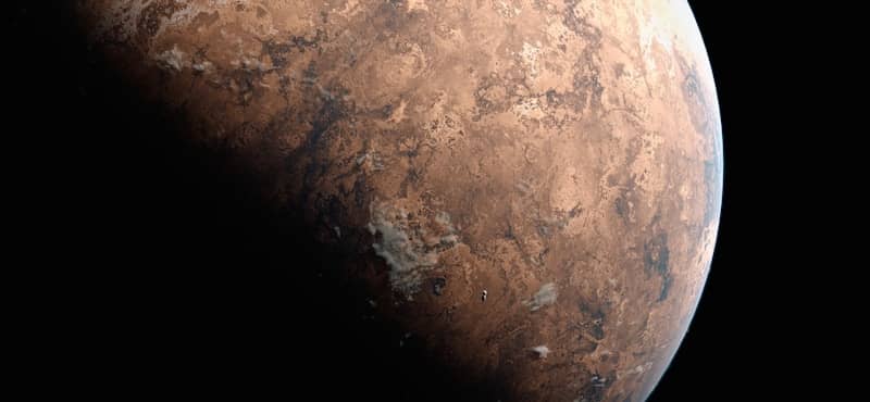 Here is the caption: a view of mars in the black of space.