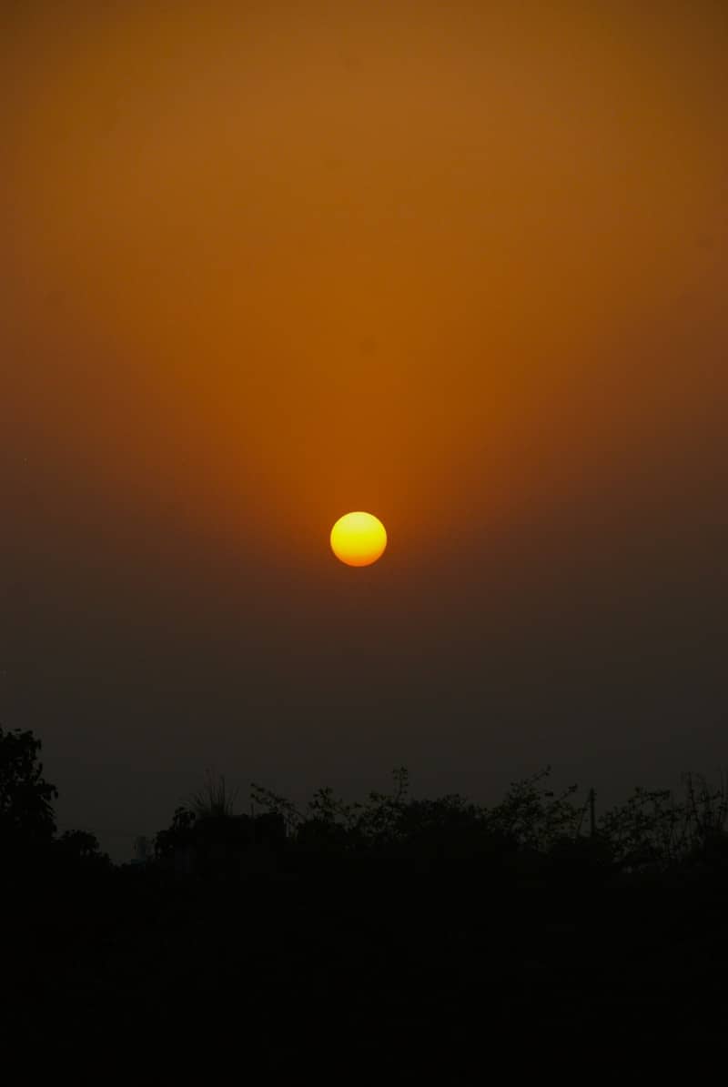 The sun sets in a beautiful, fiery sky.