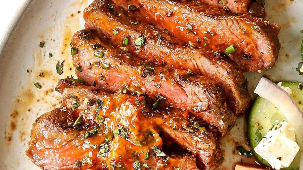 Grilled steak, sliced, drizzled with a harissa finishing butter.