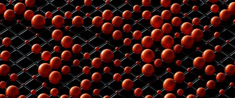Red spheres arranged on a black grid pattern