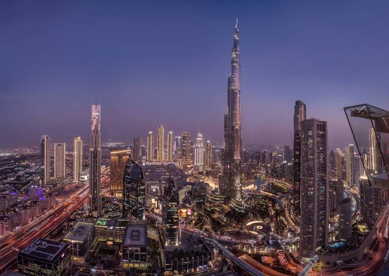 The Burj Khalifa and surrounding skyscrapers in the city of Dubai at twilight