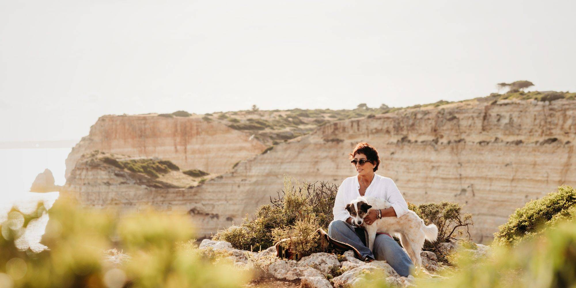 Alicia Rodriguez on cliffs with her dog Sophie