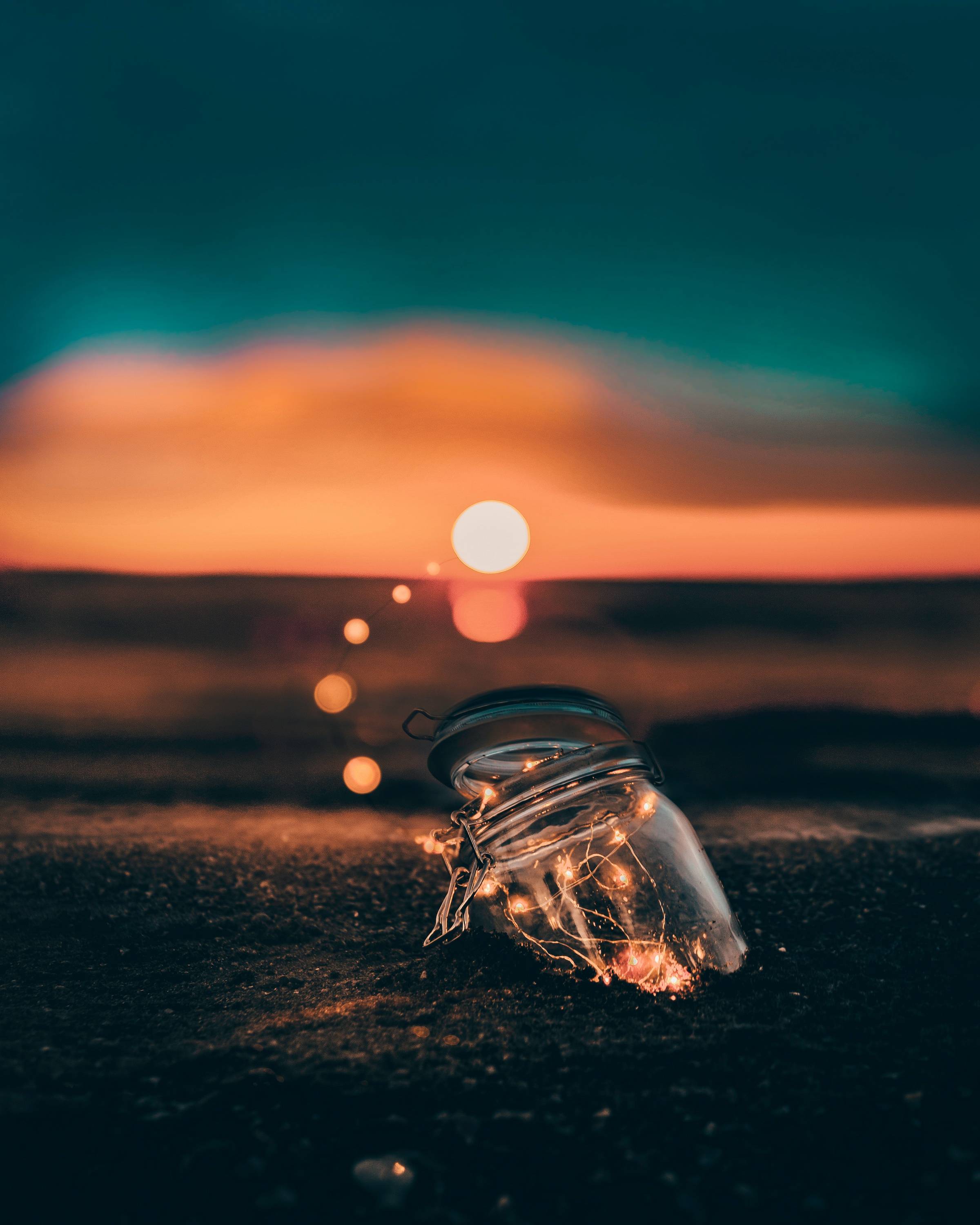 beach jar with lights at sunset