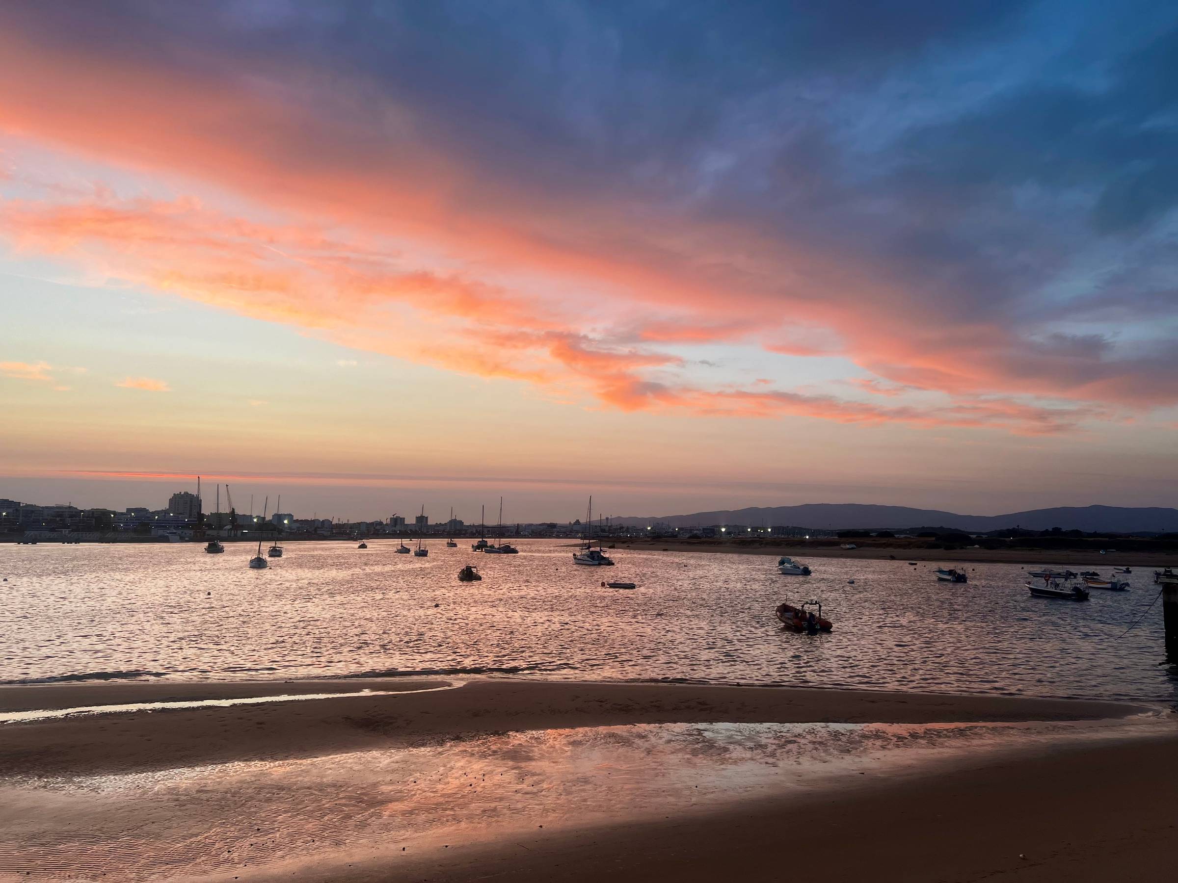 Sunset in Ferragudo Portugal boats in water