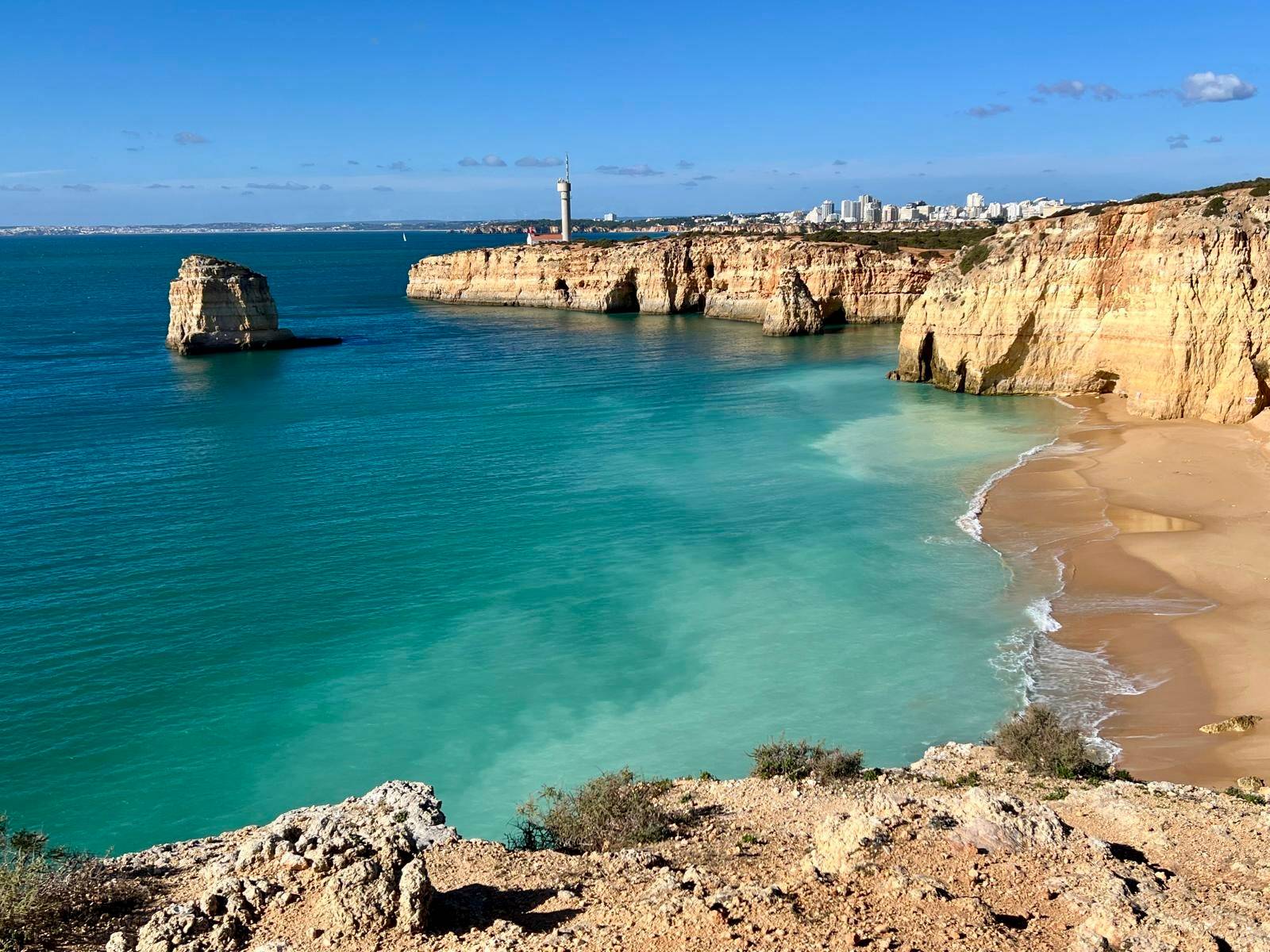 A view from the Algarve cliffs over the ocean Caneiros Beach