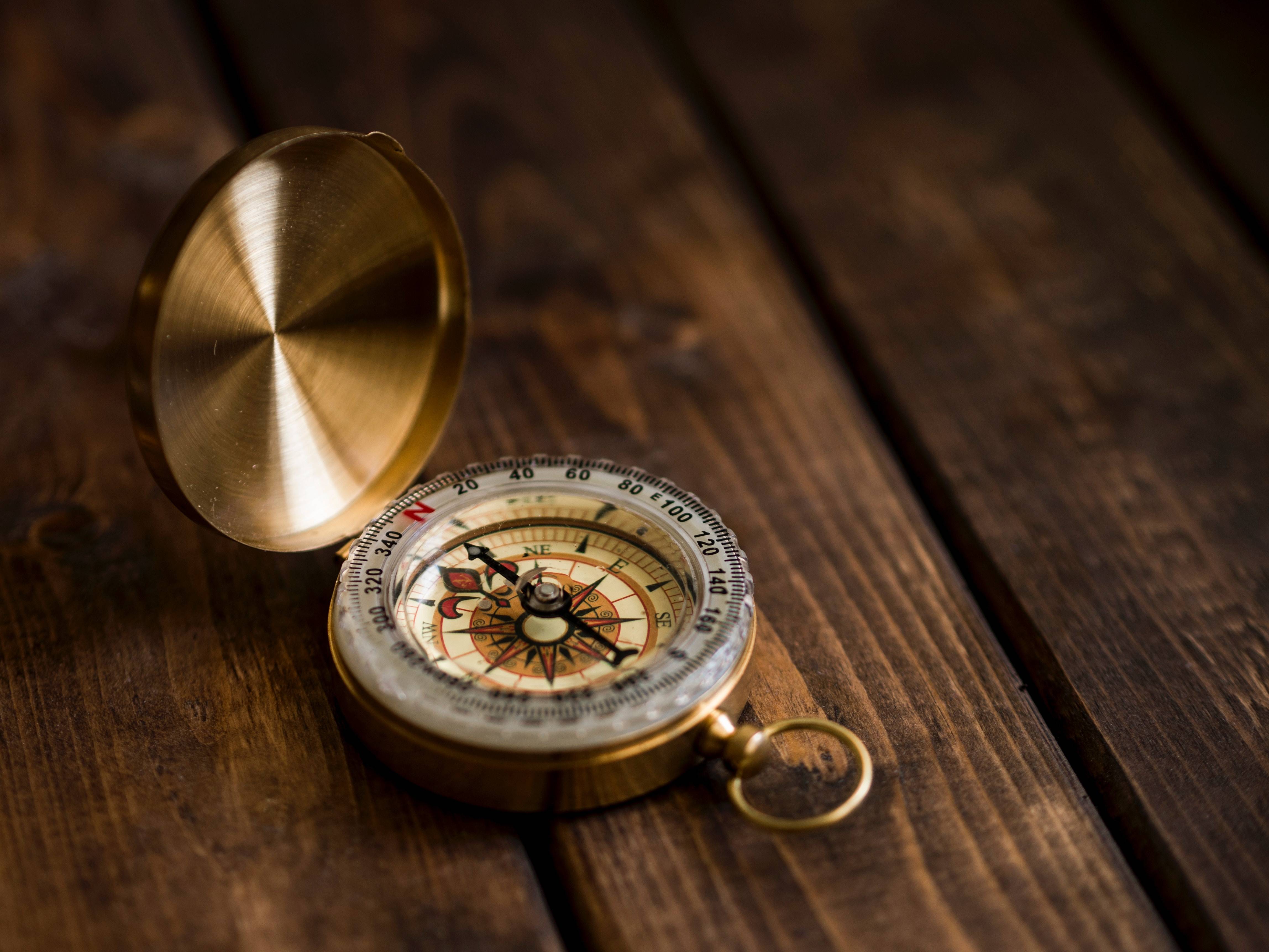 A compass on wood table