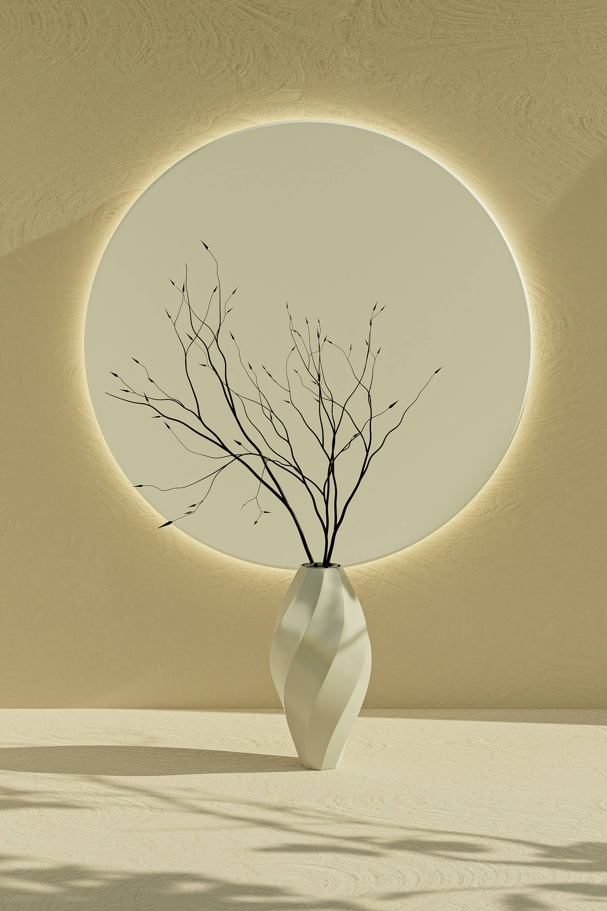 A vase against a round moon like light