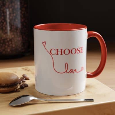 A white and red mug that reads choose love