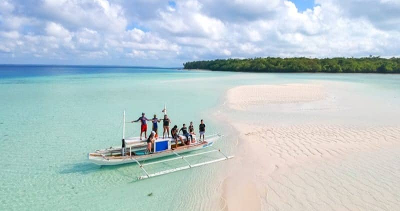 people riding on boat during daytime