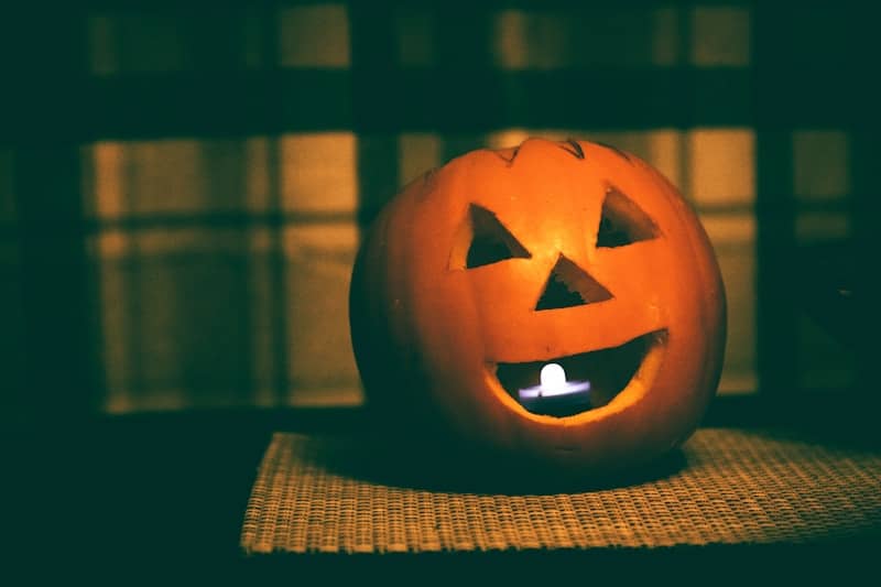 A carved pumpkin sitting on top of a table
