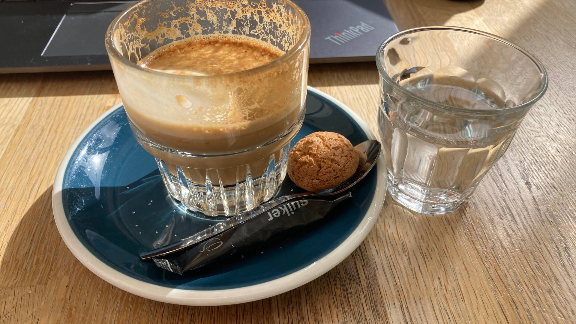 Coffee with a tiny cookie