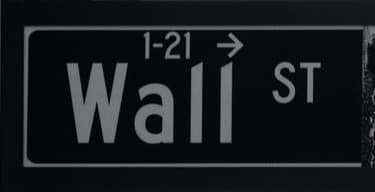 grayscale photo of Wall St. signage