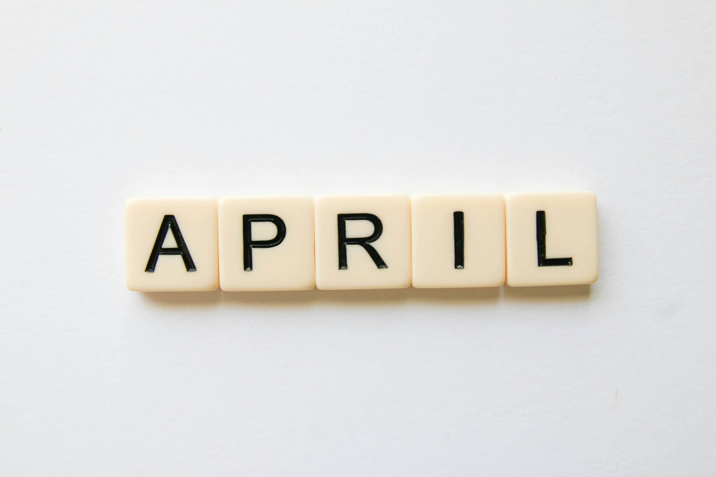 Photo of the word "April" spelled out in Scrabble letters by Glen Carrie on Unsplash