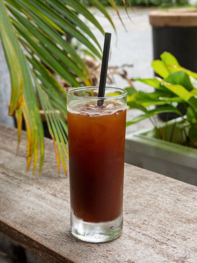 A drink sitting on top of a wooden table