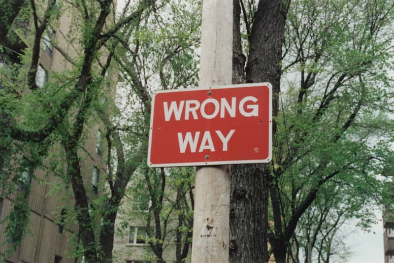 red and white wrong way sign