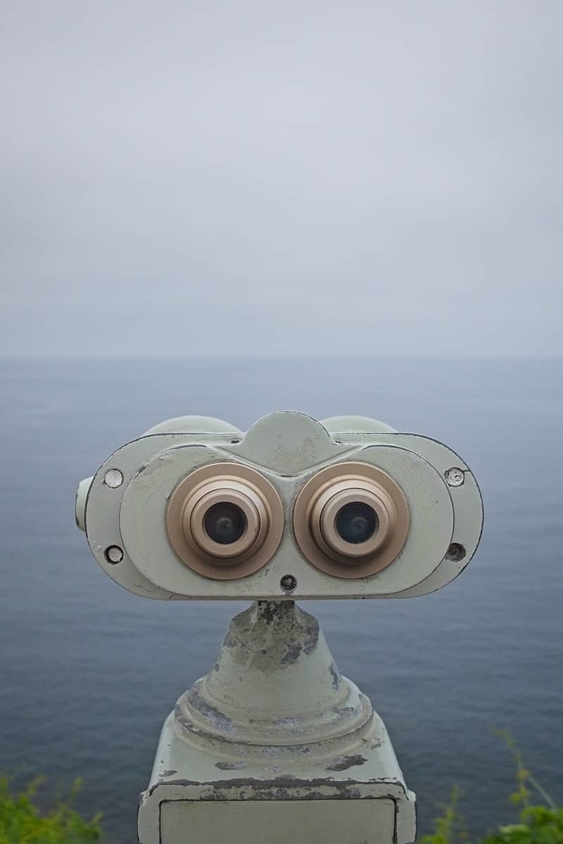 Binoculars stare out at the ocean.
