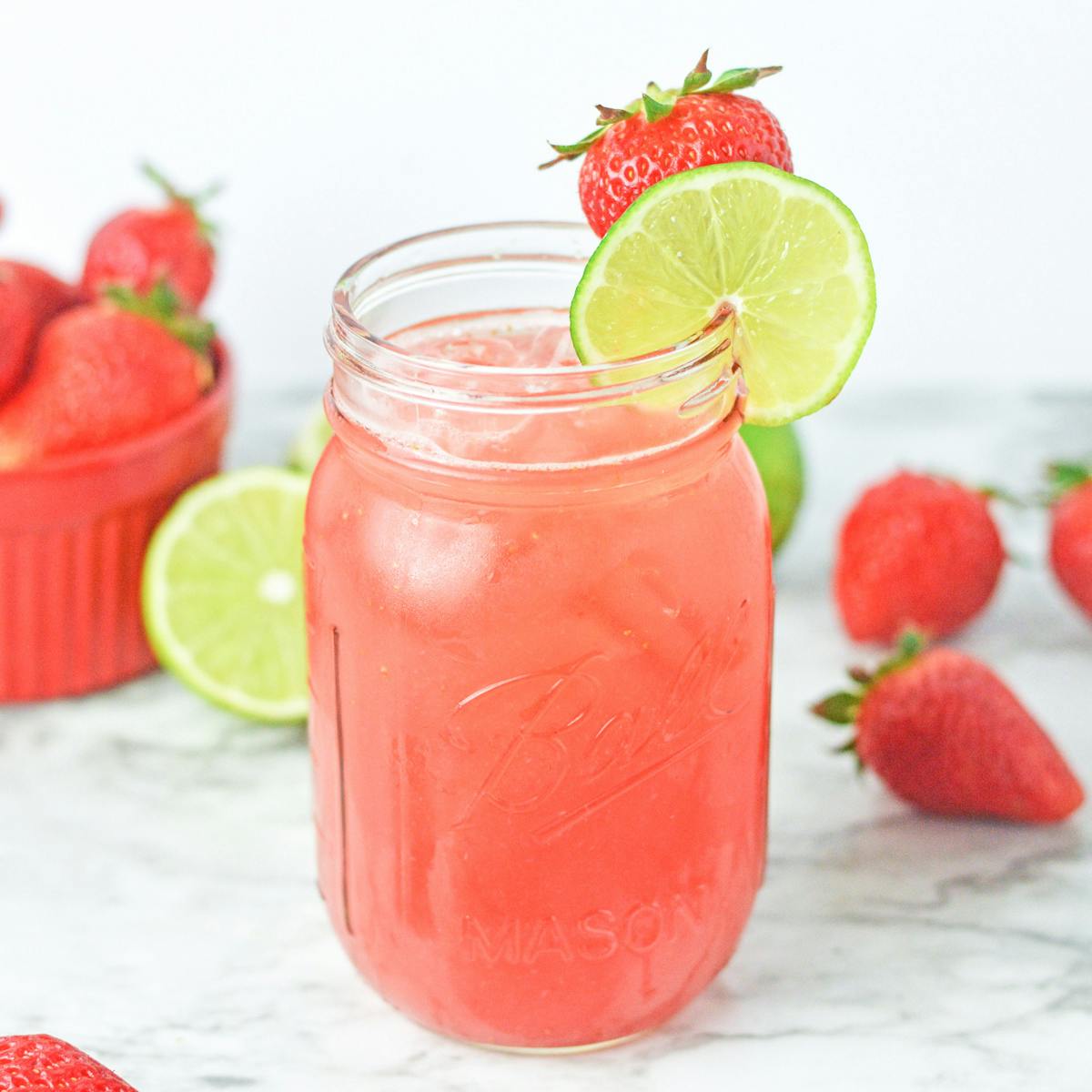 Strawberry Agua Fresca with ice in a glass