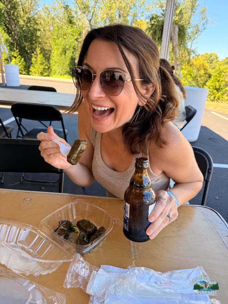 Christine eating dolmades Asheville Greek Festival NC