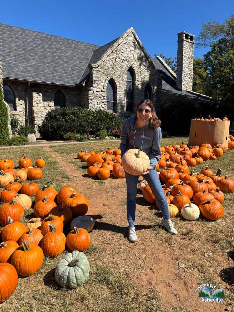 Christine picking pumpkin Grace Episcopal Church Asheville NC