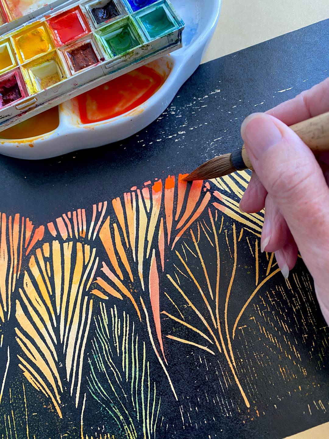 a person painting an artwork