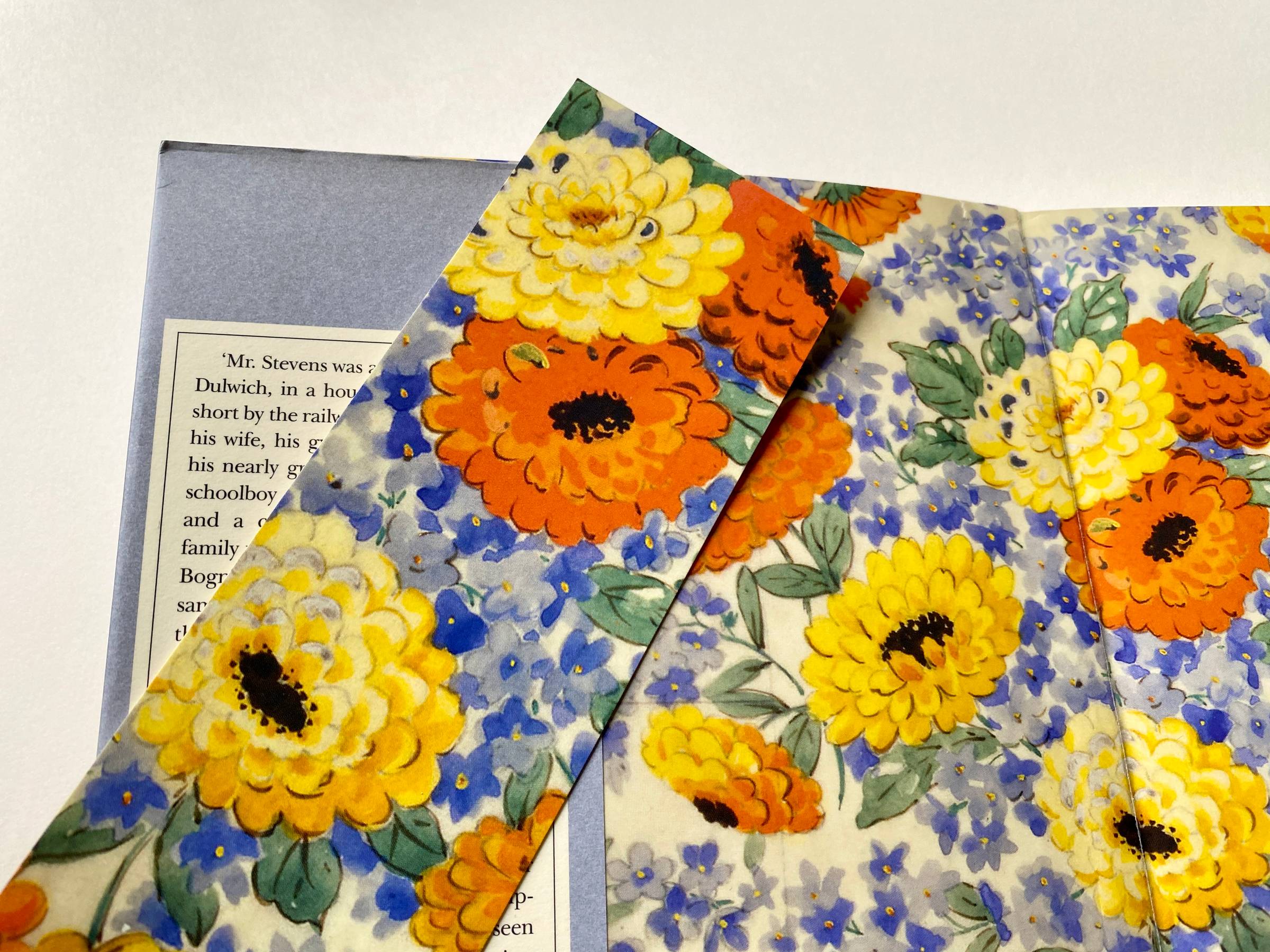 bright orange and yellow flowers on a blue background  as a bookmark and endpapers of a book