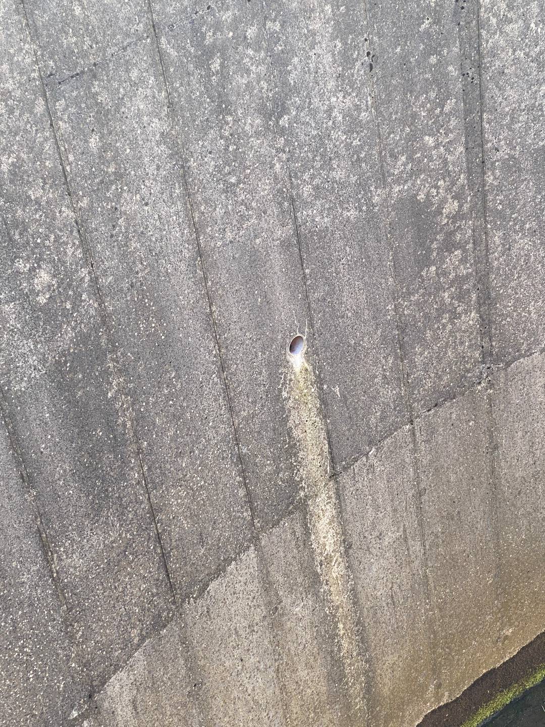 A drainage hole in a concrete structure