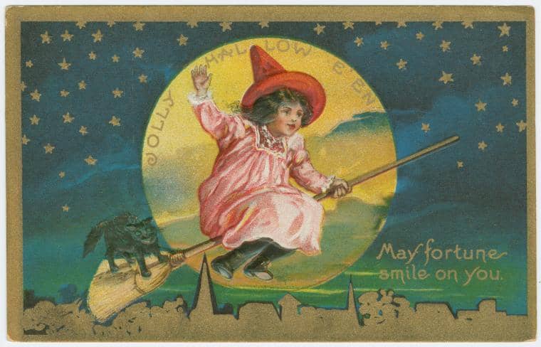 Jolly child on a broomstick with a black cat wishing good fortune 
