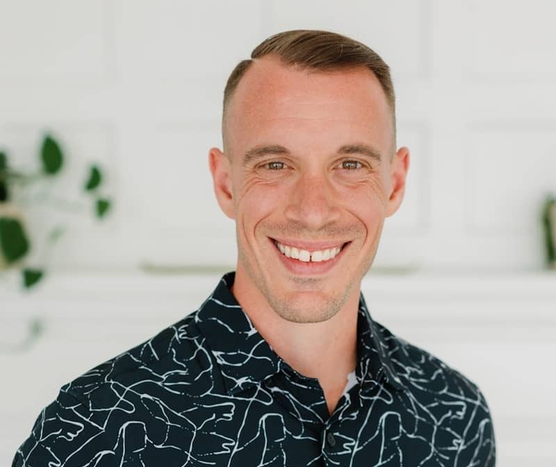 Smiling man poses for a photo.