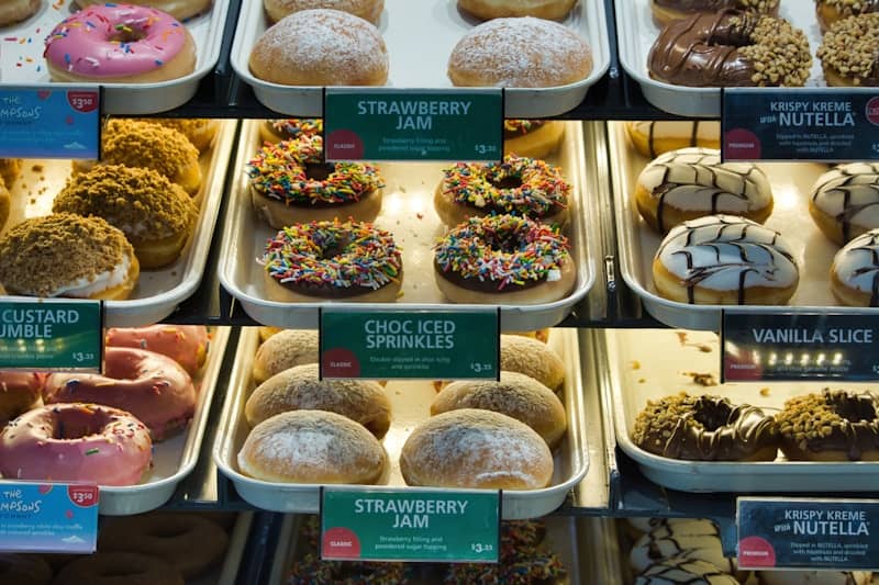 Display case filled with a variety of donuts.