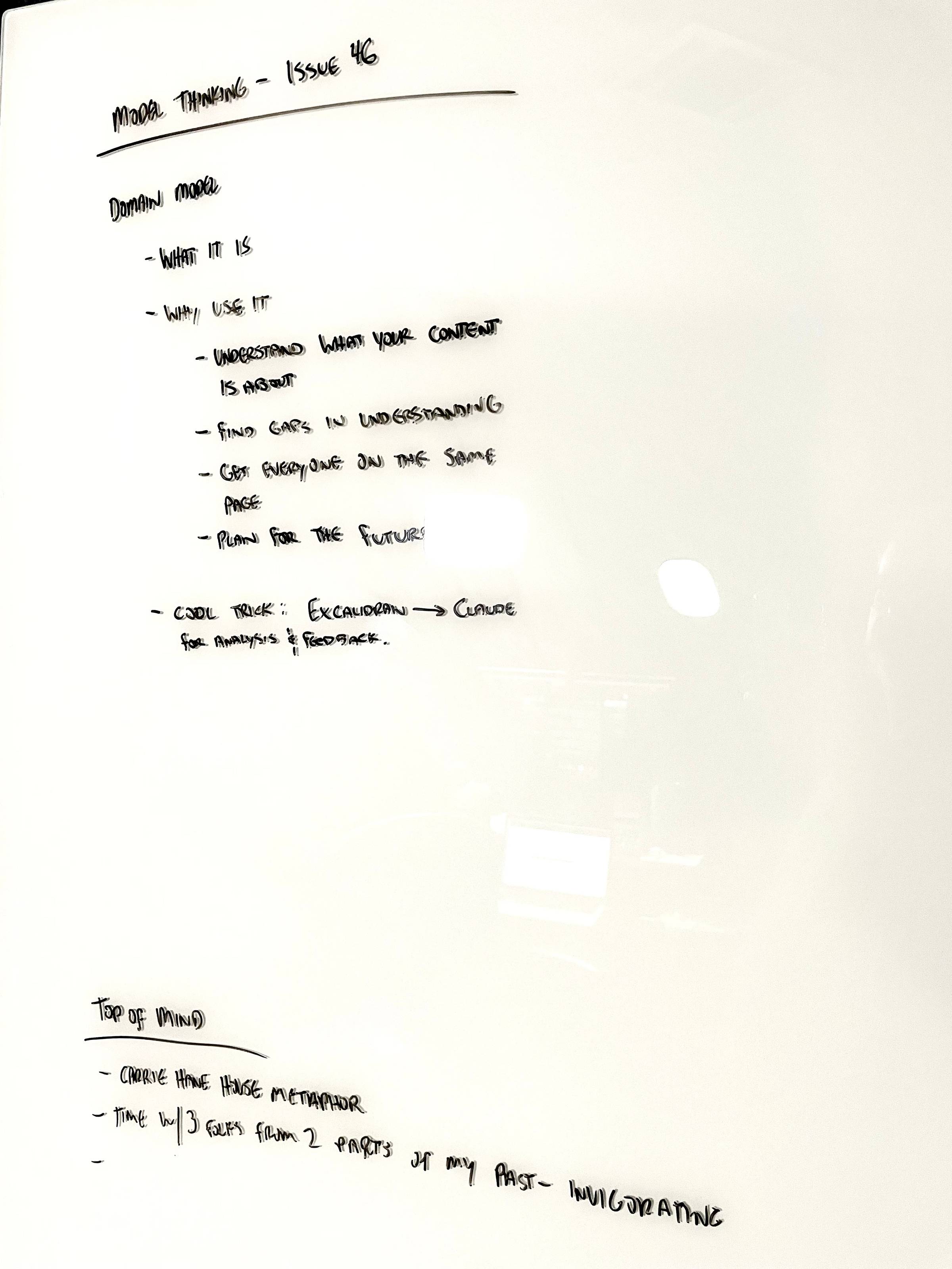 Photo of whiteboard with writing on it