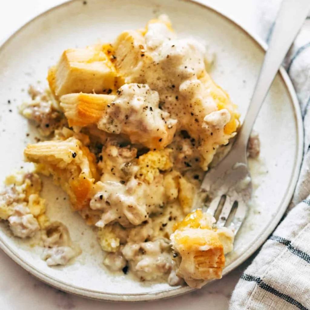 Biscuits and gravy egg bake on a plate.