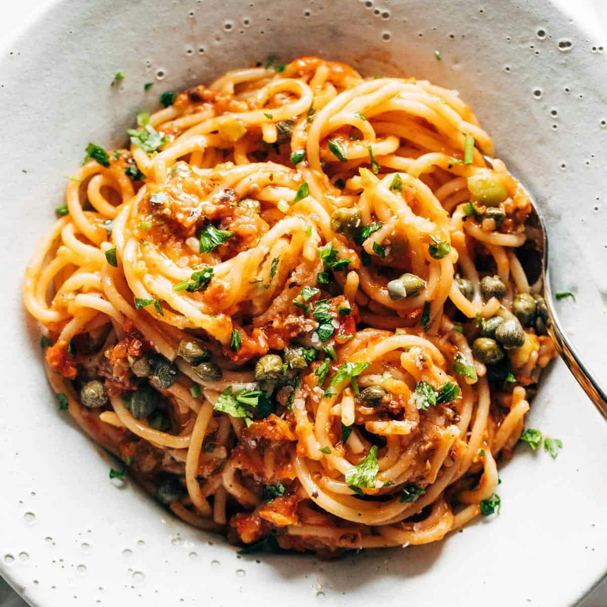 Roasted tomato puttanesca in a bowl