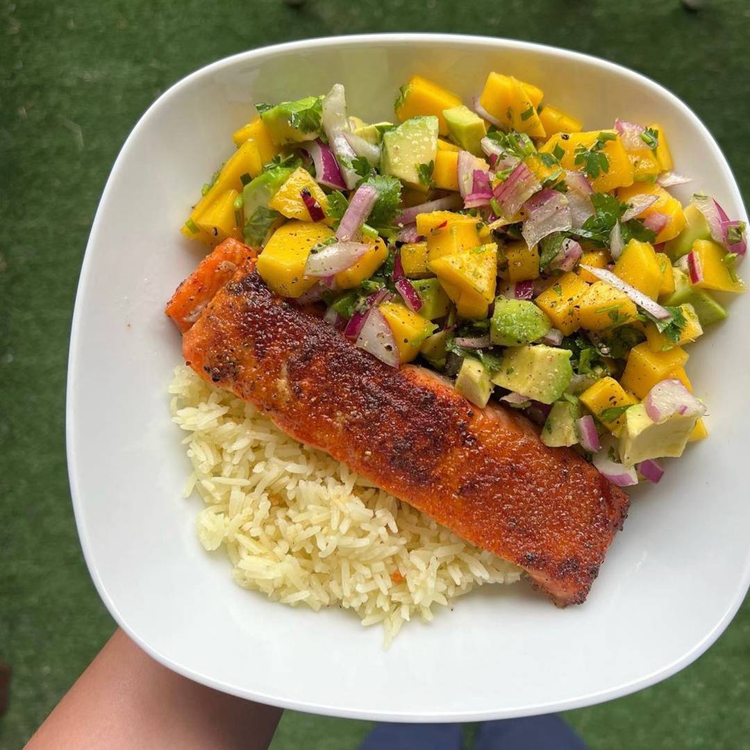 BBQ Salmon in a bowl with rice and mango avocado salsa