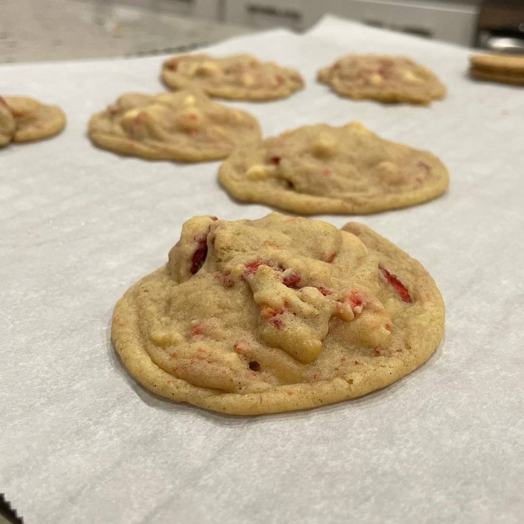Strawberry white chocolate cookies on parchment paper