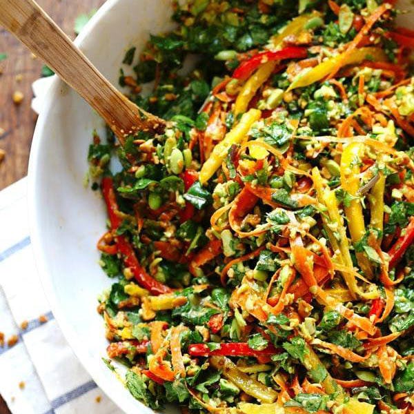 Chopped Thai salad in a bowl with a spoon. 