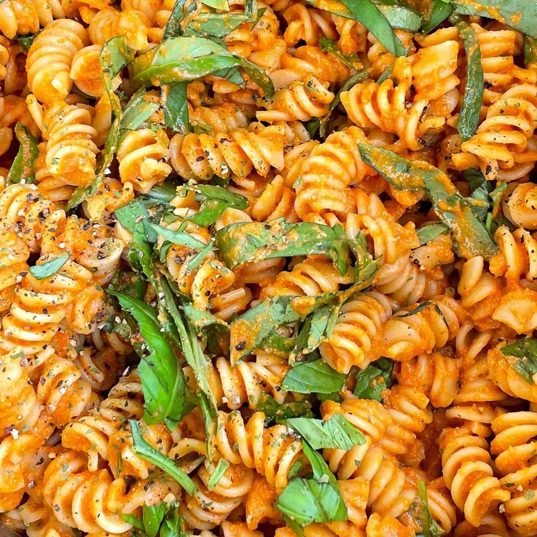 Red pepper pasta with basil on top