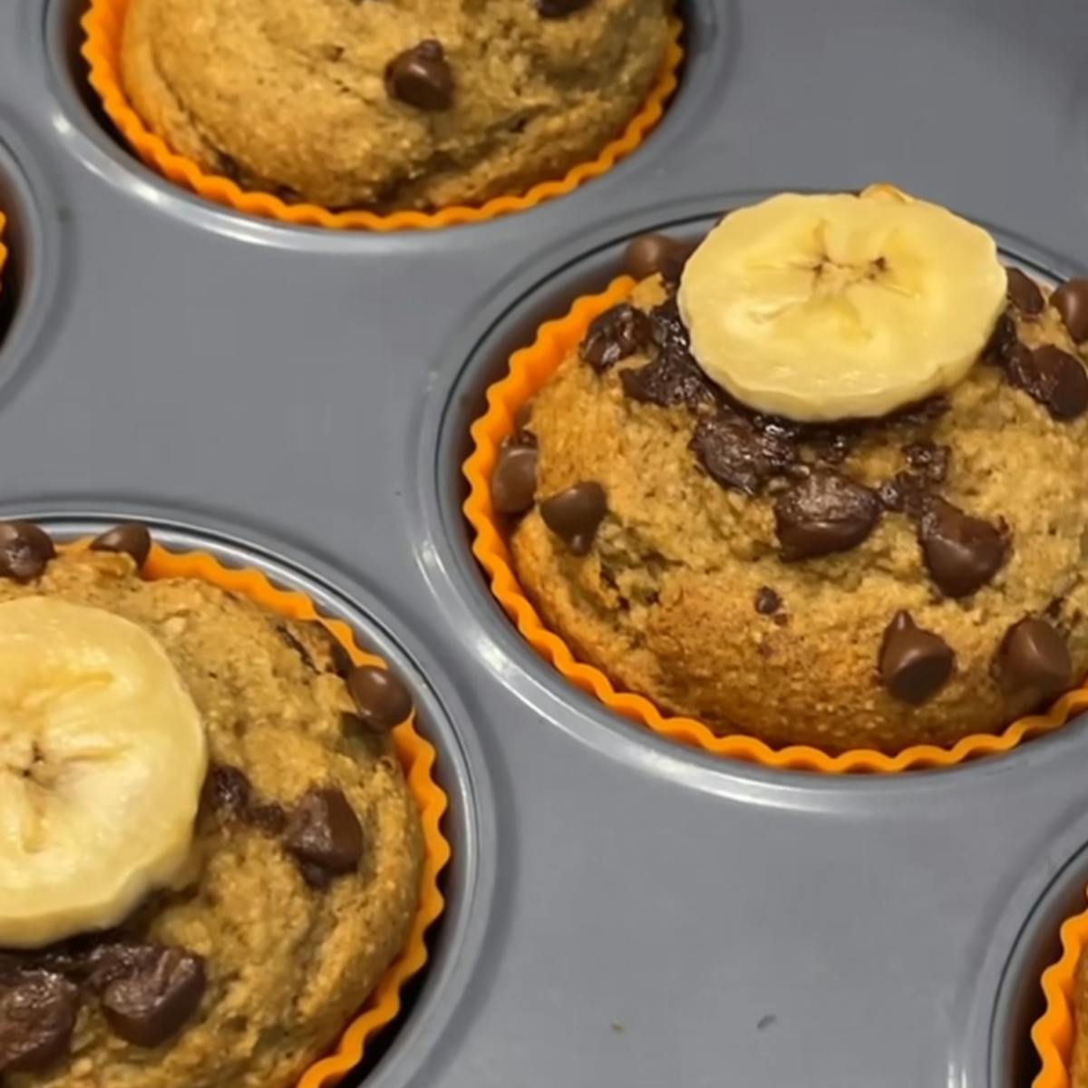 Banana muffins with chocolate chips and a banana slice on top