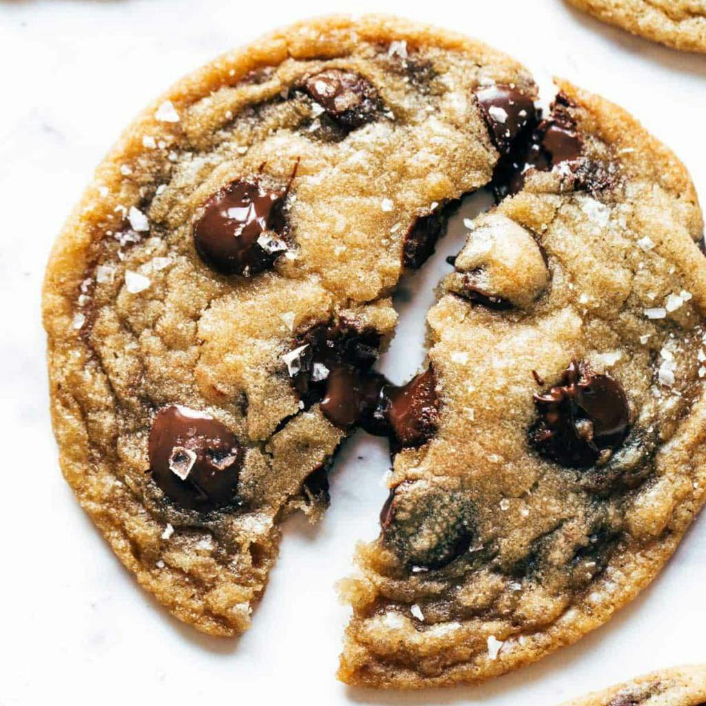 Browned butter chocolate chip cookies broken in half.