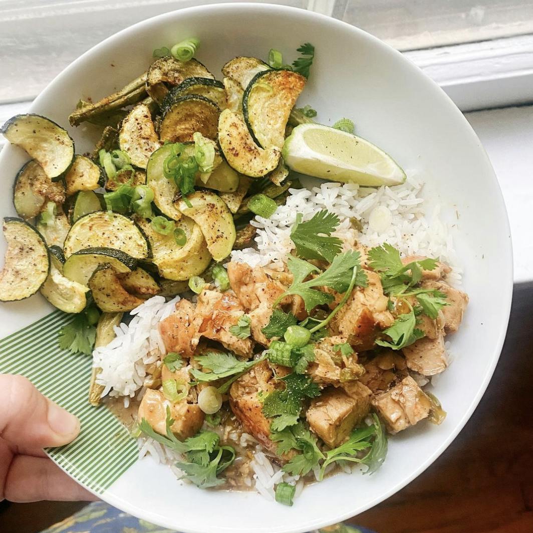 Lemongrass chicken in a bowl with zucchini.