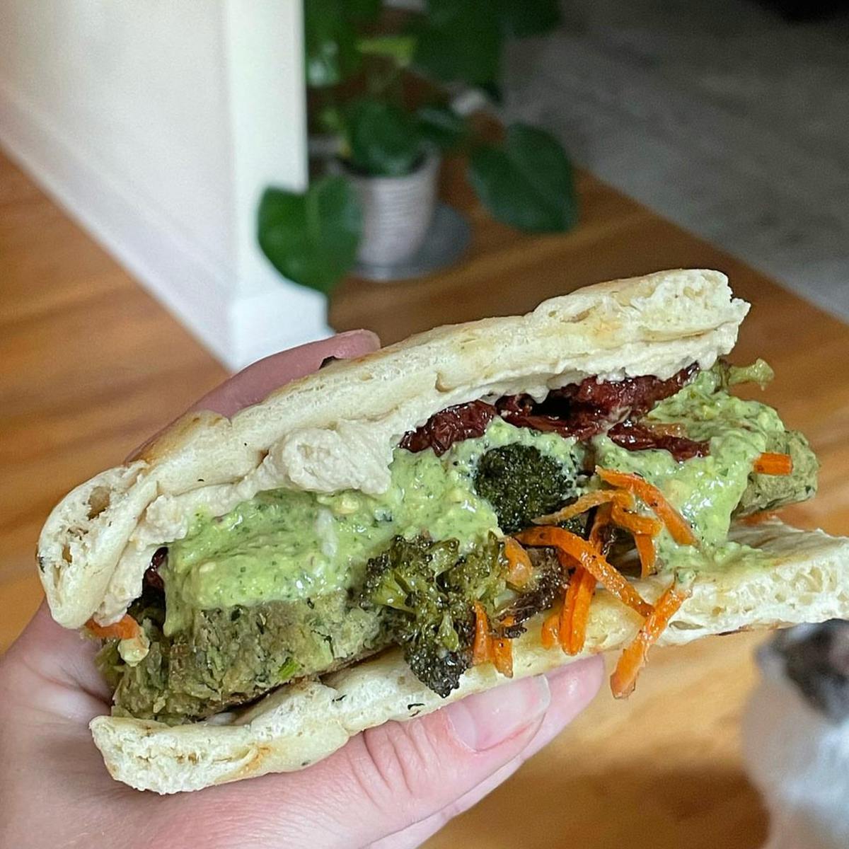 Falafel sandwich with veggies on naan bread