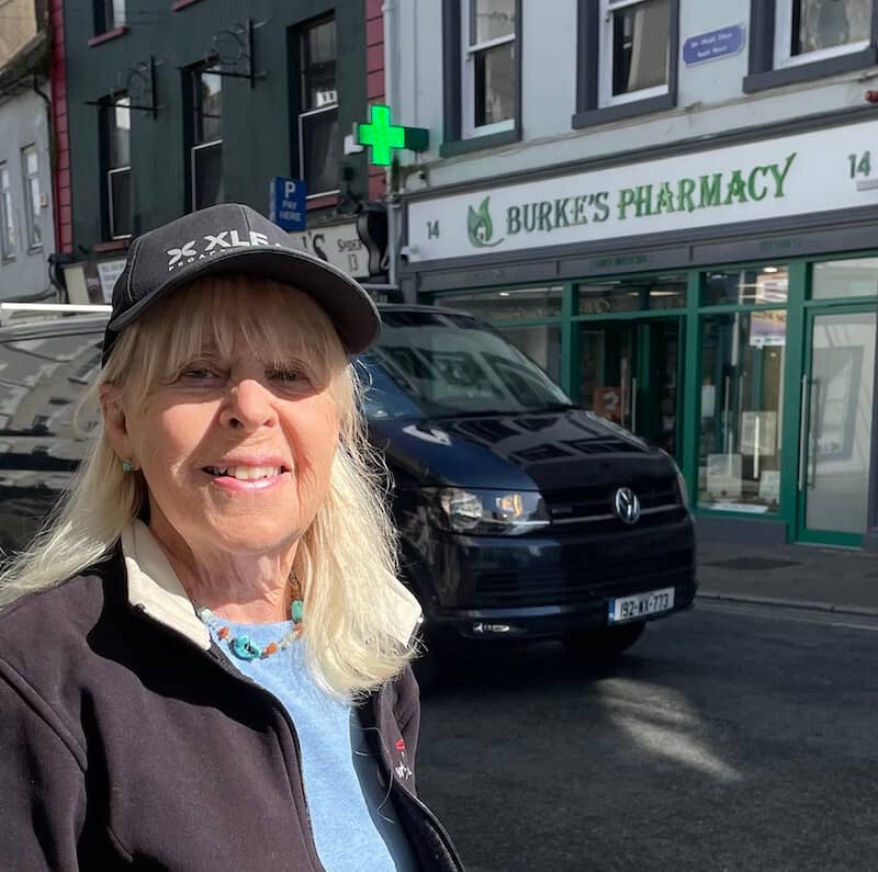 Pamela Burke in front of the Burke's Pharmacy in Irelannd on her journey to find her father's ancestors | Photo: P. Burke