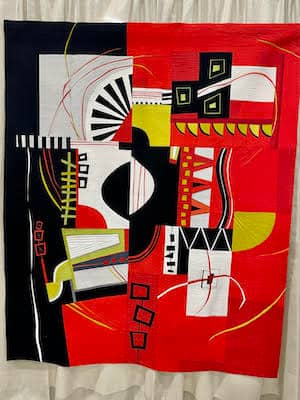 Quilt-“Mama Don't 'Low" by Patty Simmons, machine pieced improvisational quilting, representing real to homemade instruments | Photo: P. Burke