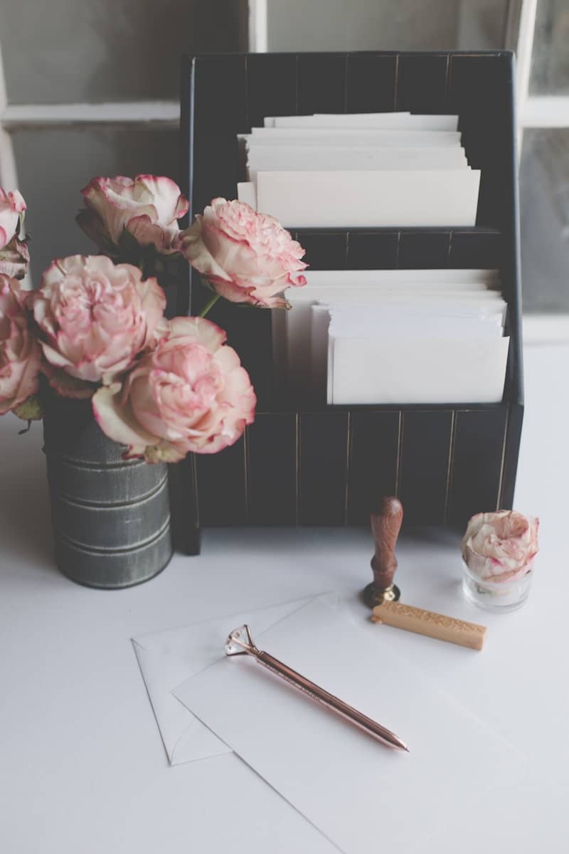 Pink roses and stationery with a wax seal