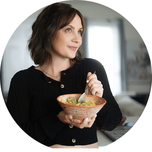 Woman Losing weight while on Souper Shed Plan with a bowl of curry veggies.