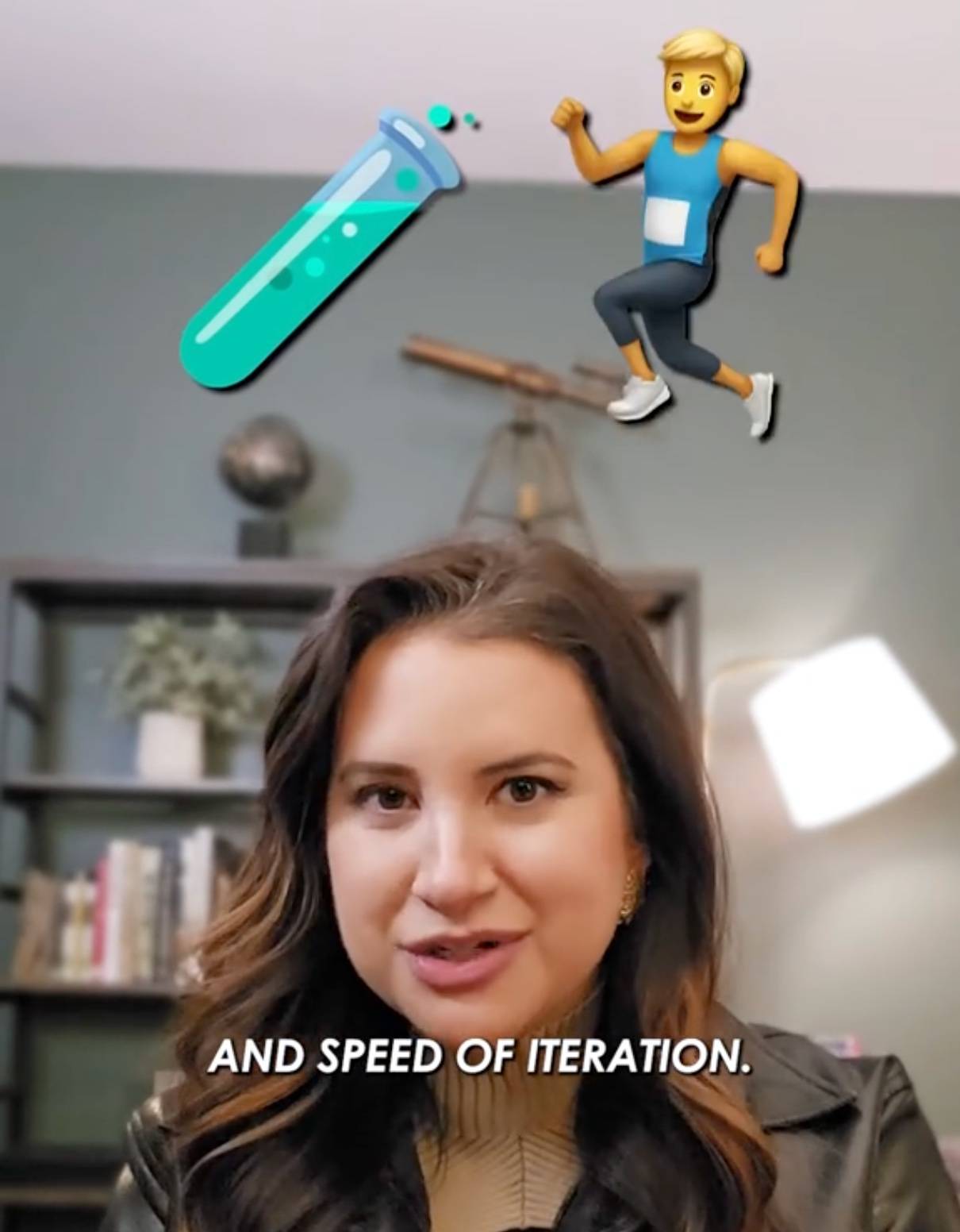 Video image of white woman with brown hair, intense look. Emoticons above her are test tube and man running in race. Text below here face reads, "and speed of iteration."