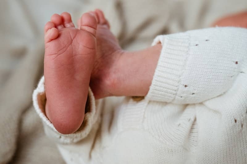 Close up of a newborn baby's tiny feet