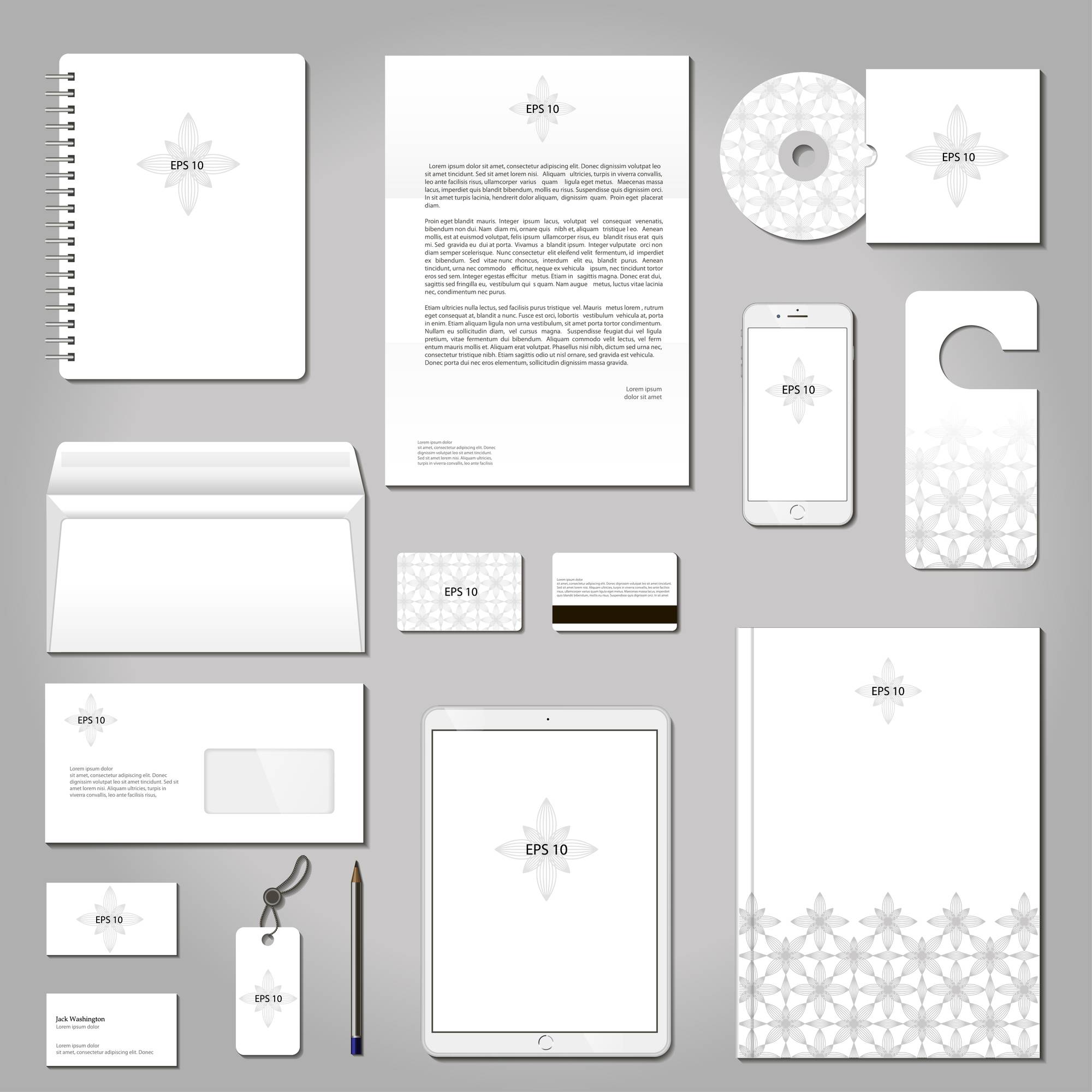 a flat lay of a simple white brand kit on a gray background