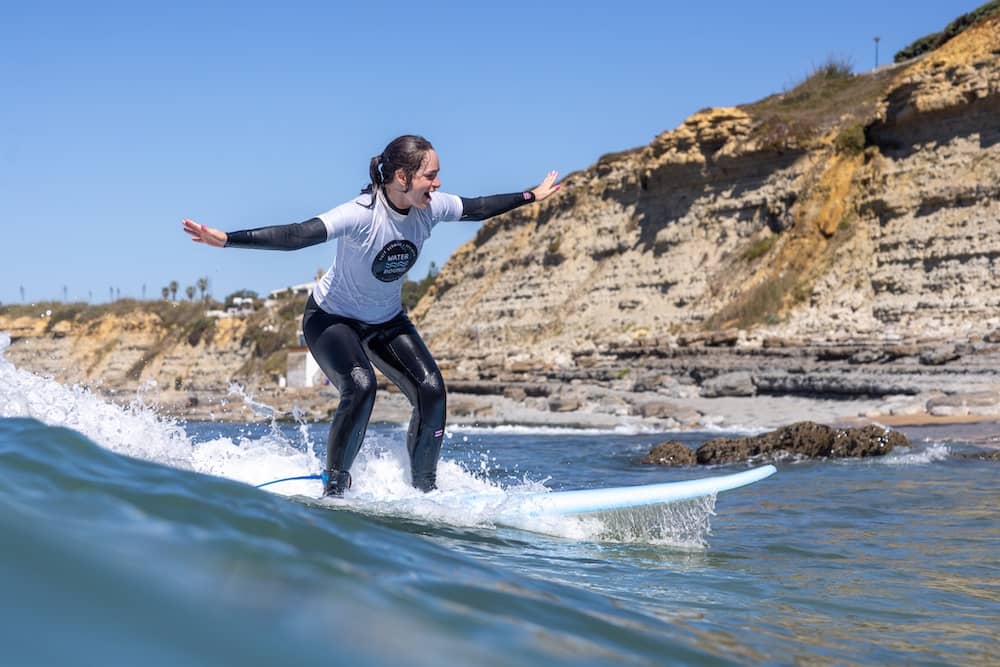 Charli on a surf board in the Atlantic ocean