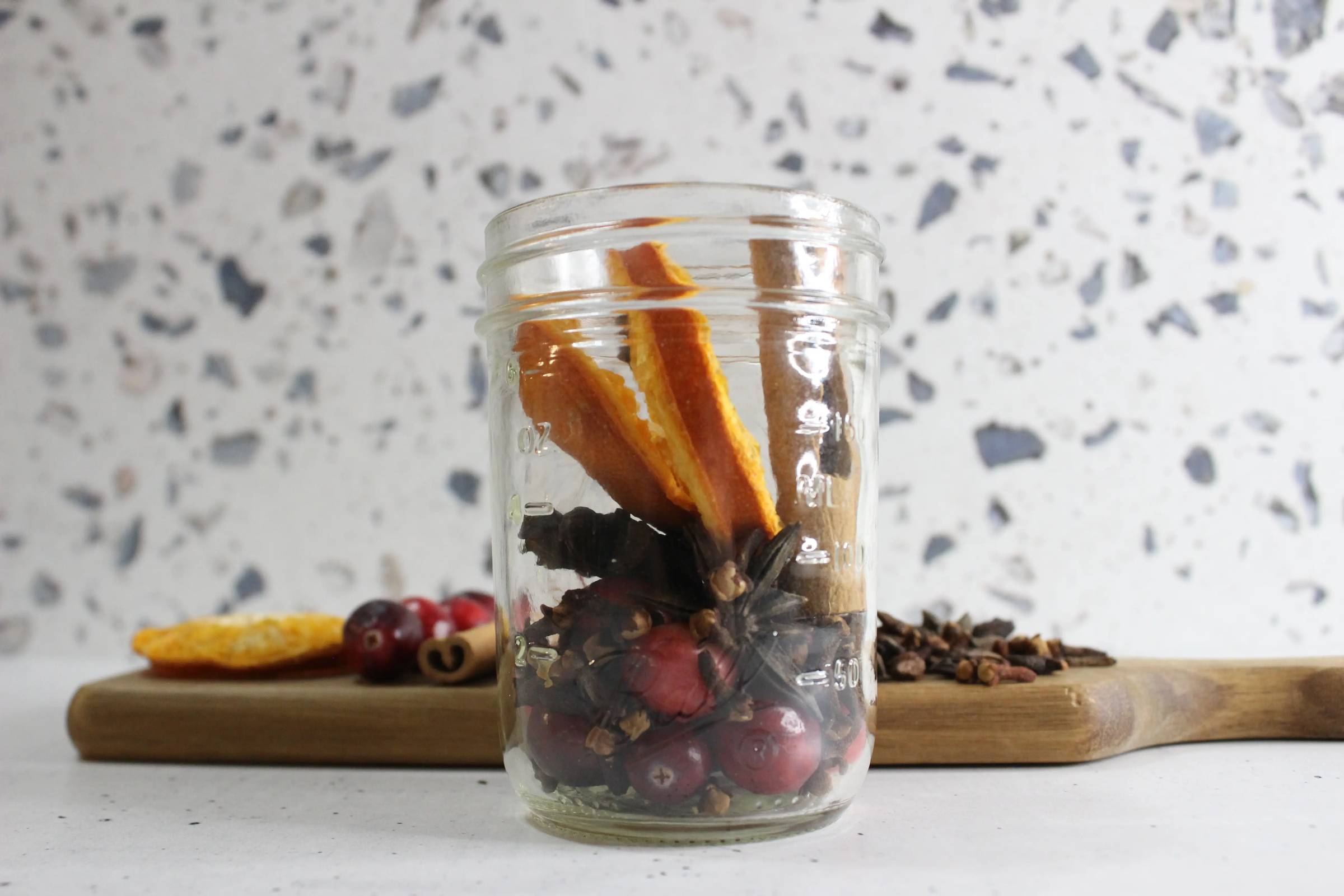 a jar with fall simmer pot ingredients